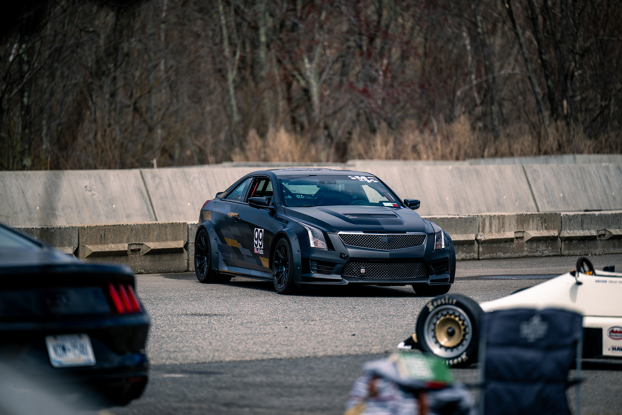 Black Cadillac ATS-V coupe on track at Palmer Motorsports Park